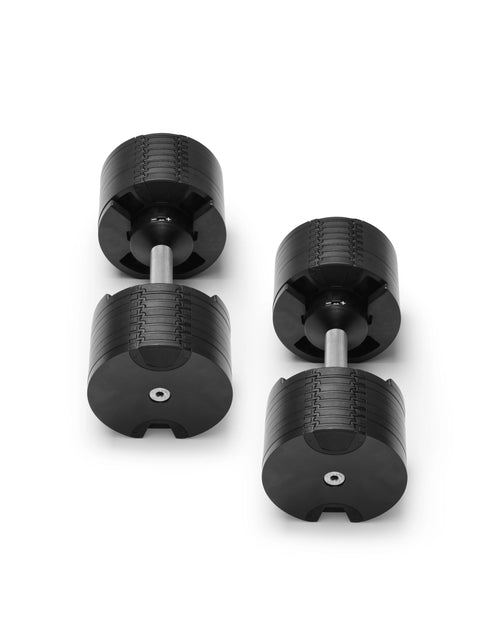 NÜOBELL 580 silver adjustable dumbbells featuring sleek design and easy weight adjustment, perfect for space-saving home workouts and versatile strength training.