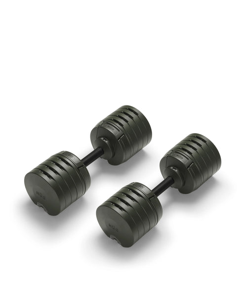 NÜOBELL S 240 Forest – stylish, compact adjustable dumbbell in forest green, designed for efficient home strength training with quick weight changes and robust Swedish craftsmanship.