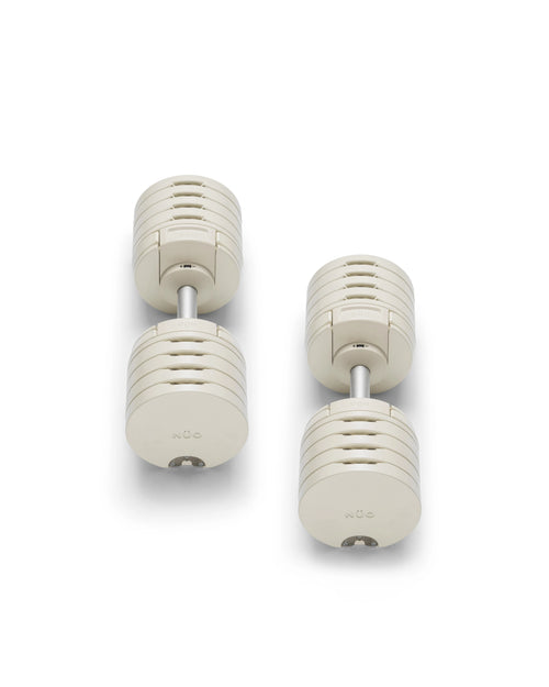 NÜOBELL S 5100 Sand – premium adjustable dumbbell set in sand color, offering compact design and easy weight adjustments for versatile home strength training sessions.