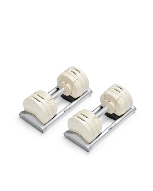 Close-up of NÜOBELL S 224 Sand adjustable dumbbell with sleek sand-colored finish designed for space-saving versatile strength training in any home gym