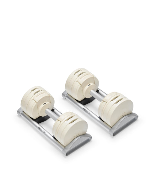Close-up of NÜOBELL S 224 Sand adjustable dumbbell with sleek sand-colored finish designed for space-saving versatile strength training in any home gym