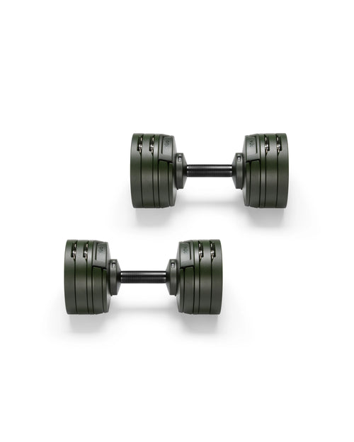 Close-up of NÜOBELL S 560 Green adjustable dumbbell featuring vibrant green finish, compact design, and easy weight adjustments for efficient home workouts