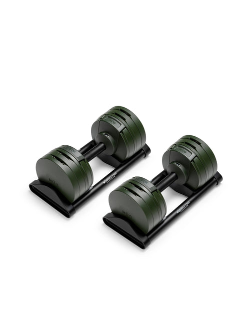 Close-up of NÜOBELL S 560 Green adjustable dumbbell featuring vibrant green finish, compact design, and easy weight adjustments for efficient home workouts
