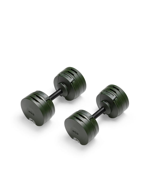 Close-up of NÜOBELL S 560 Green adjustable dumbbell featuring vibrant green finish, compact design, and easy weight adjustments for efficient home workouts