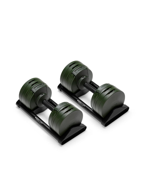 Close-up of NÜOBELL S 560 Green adjustable dumbbell featuring vibrant green finish, compact design, and easy weight adjustments for efficient home workouts