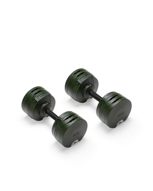 Close-up of NÜOBELL S 560 Green adjustable dumbbell featuring vibrant green finish, compact design, and easy weight adjustments for efficient home workouts