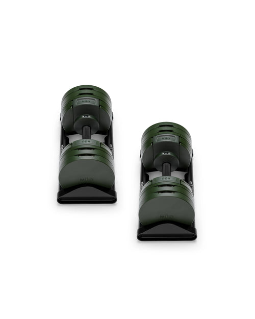 Close-up of NÜOBELL S 560 Green adjustable dumbbell featuring vibrant green finish, compact design, and easy weight adjustments for efficient home workouts