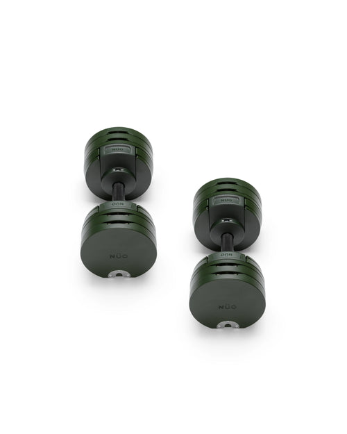 Close-up of NÜOBELL S 560 Green adjustable dumbbell featuring vibrant green finish, compact design, and easy weight adjustments for efficient home workouts
