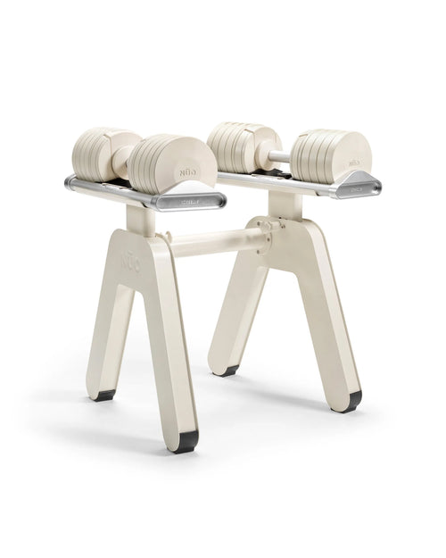 NÜOBELL S Pylon Floor Stand Sand – sturdy sand-colored floor stand designed to securely hold NÜOBELL adjustable dumbbells, perfect for organized and space-saving home gyms.